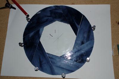 Stained-glass Aperture Science logo being made