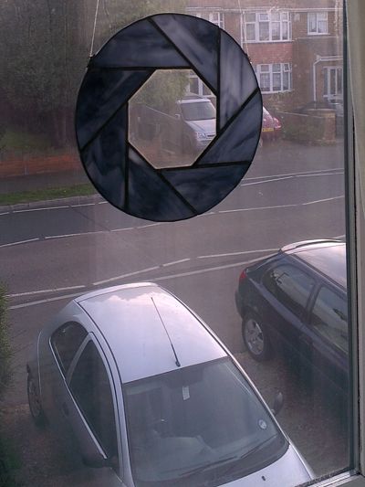 Stained-glass Aperture Science logo