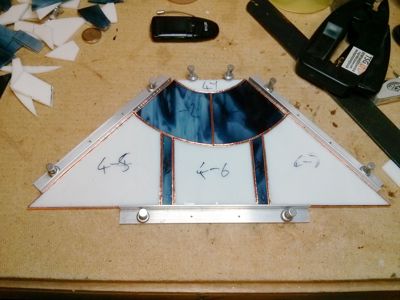 Stained-glass lampshade panel on drawing board