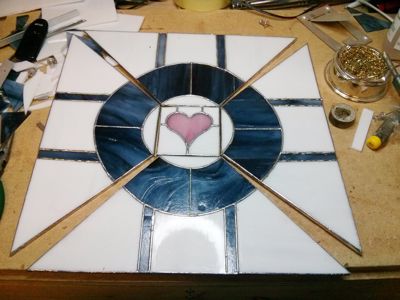 Stained-glass lampshade segments laid flat