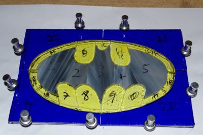 Stained glass batman logo in pieces